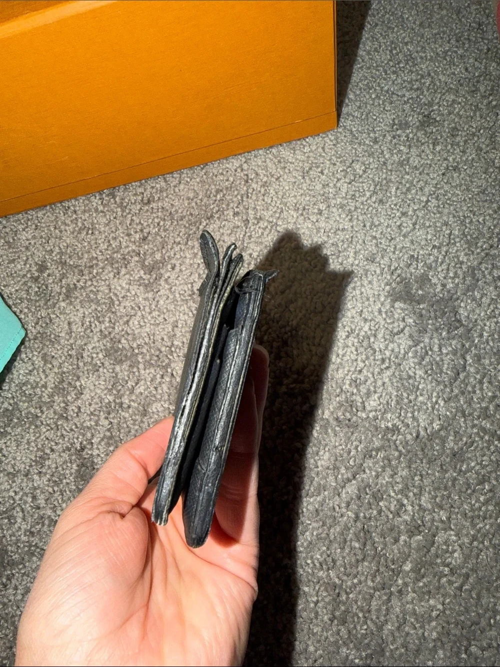 Louis Vuitton Black Leather Wallet with Pebbled Texture